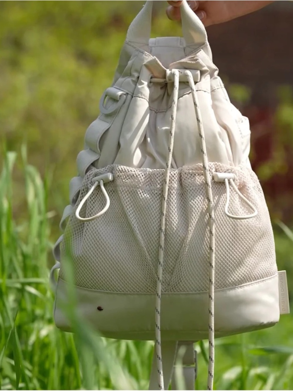 Dagne Dover Nova Sling One Shoulder Drawstring Bag in moonbeam color